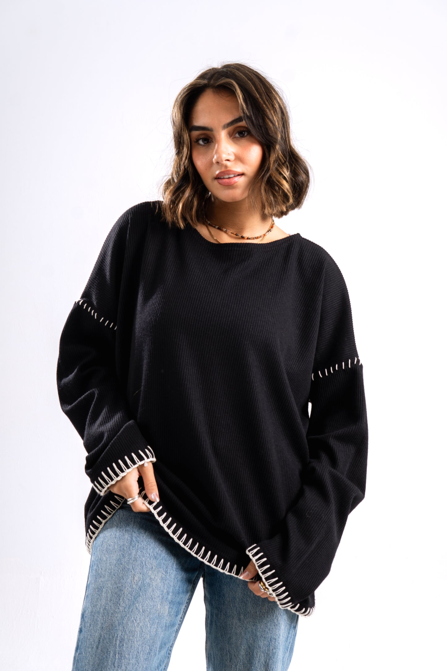 Black stitched ribbed sweater